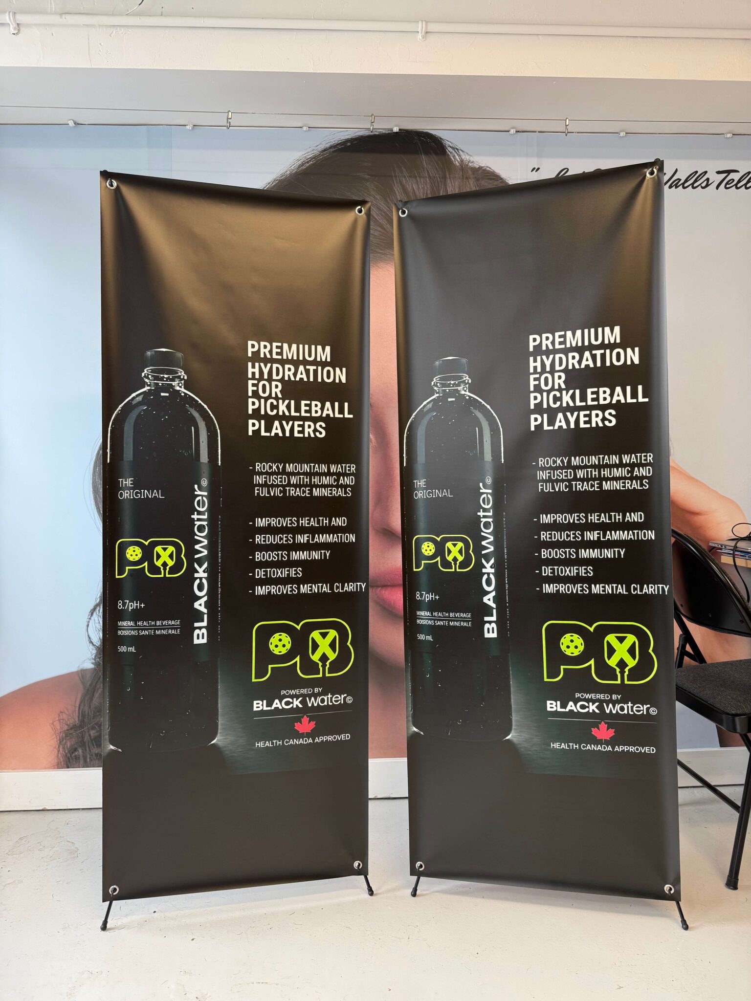 a water bottle X-banner stand advertisement